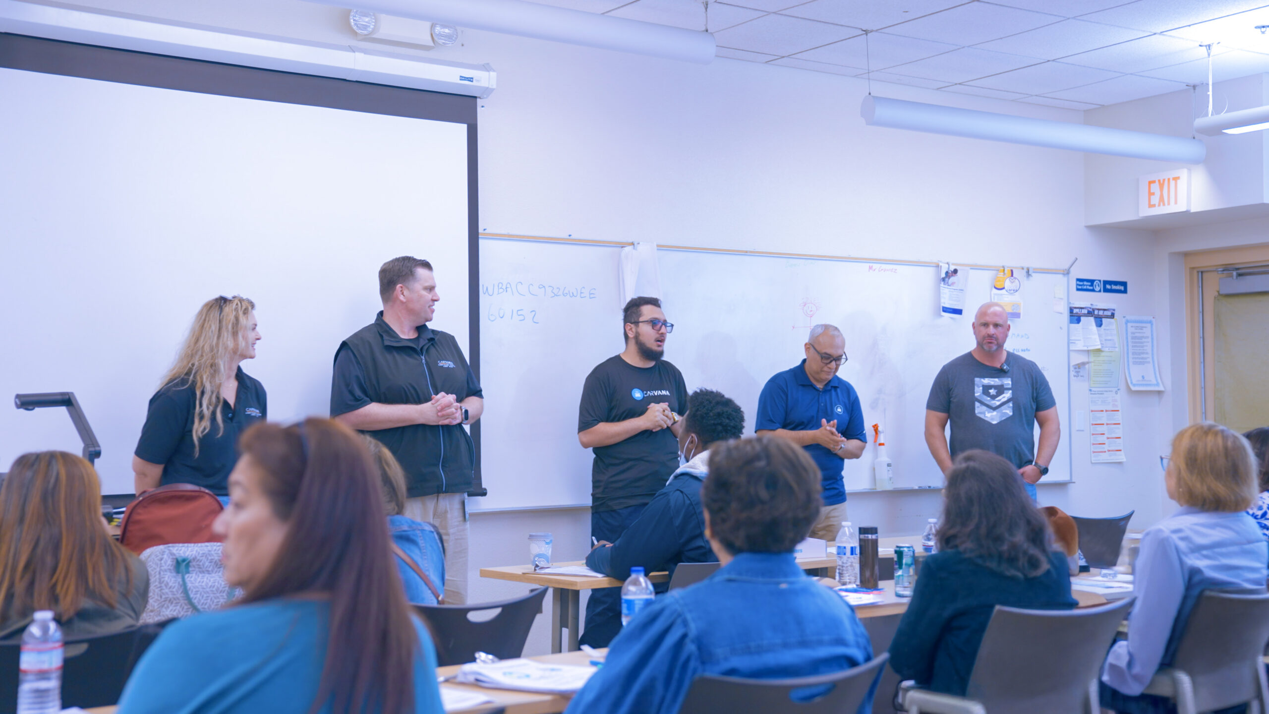 Carvana and Legacy Motor Club team members lead a career paths presentation for SDCCE Auto Technology students.