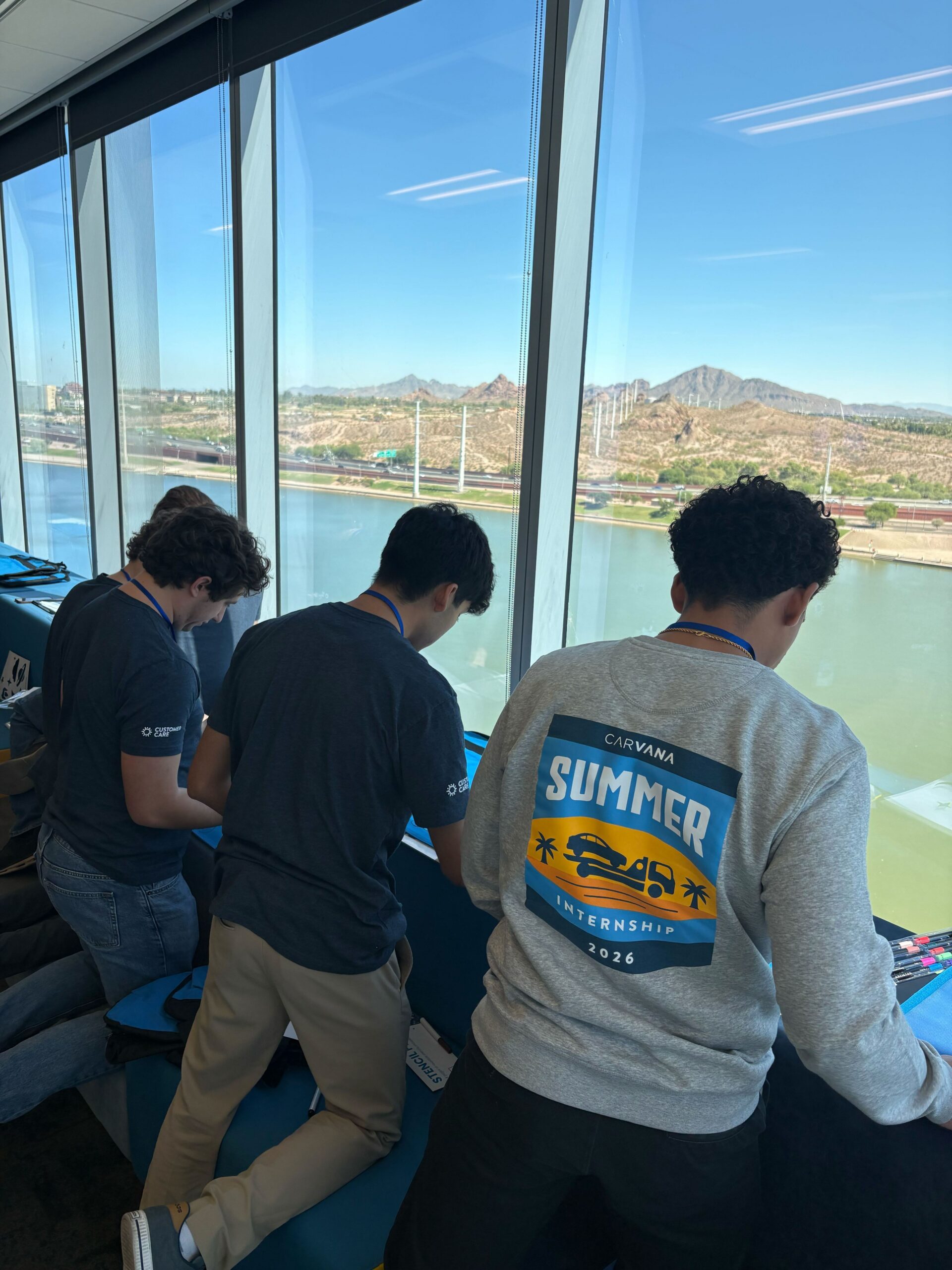 Carvana interns and team members working on a volunteer project to support foster children.